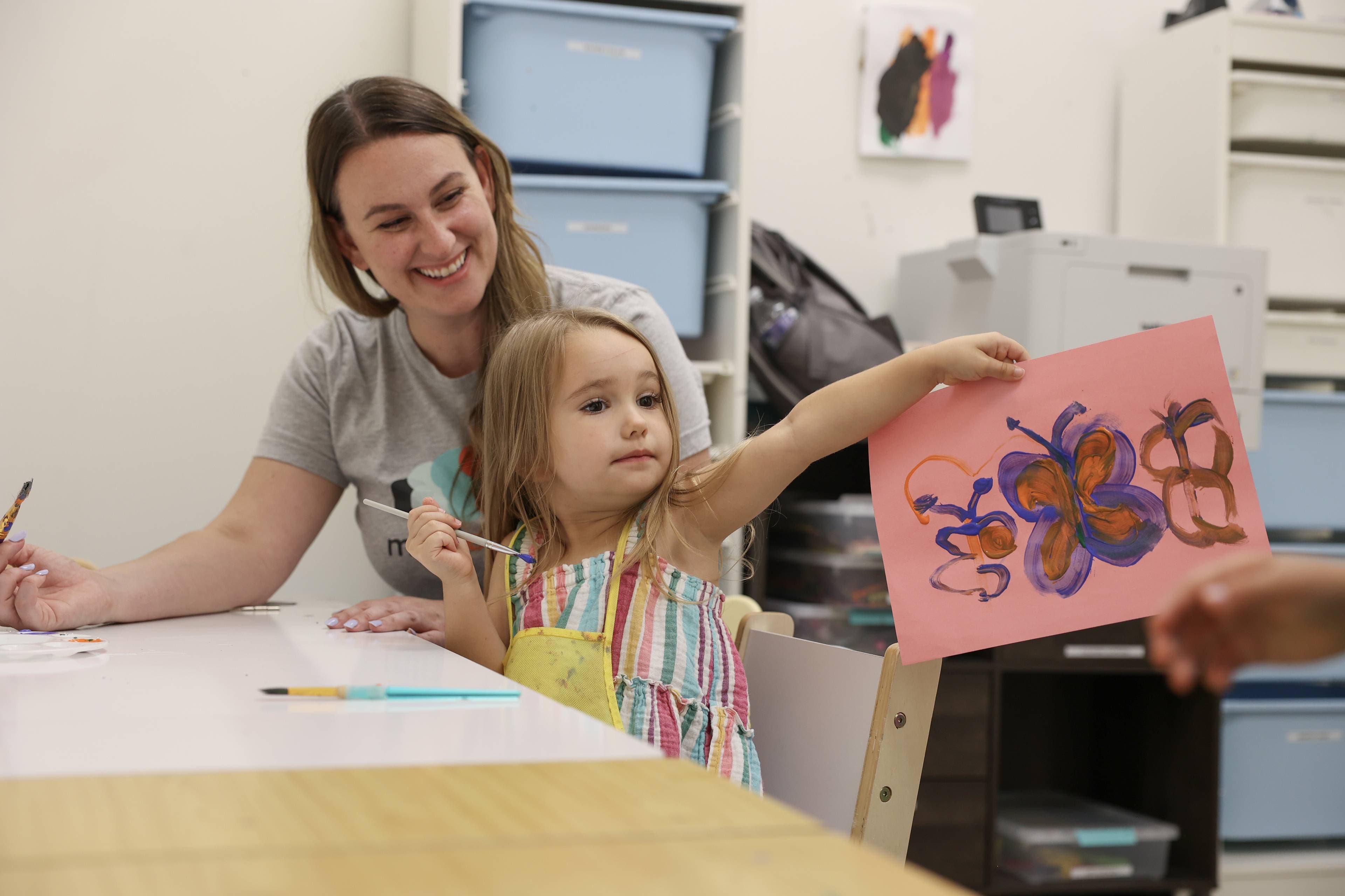 Therapist working one-on-one with child using hands-on learning tools